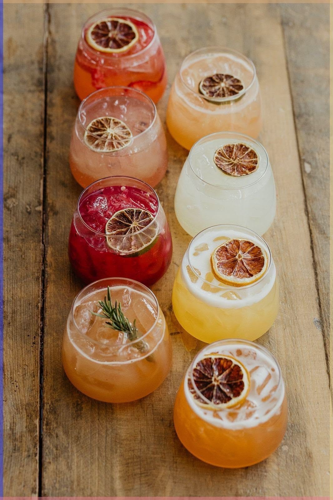 Colourful cocktails with dried citrus garnishes