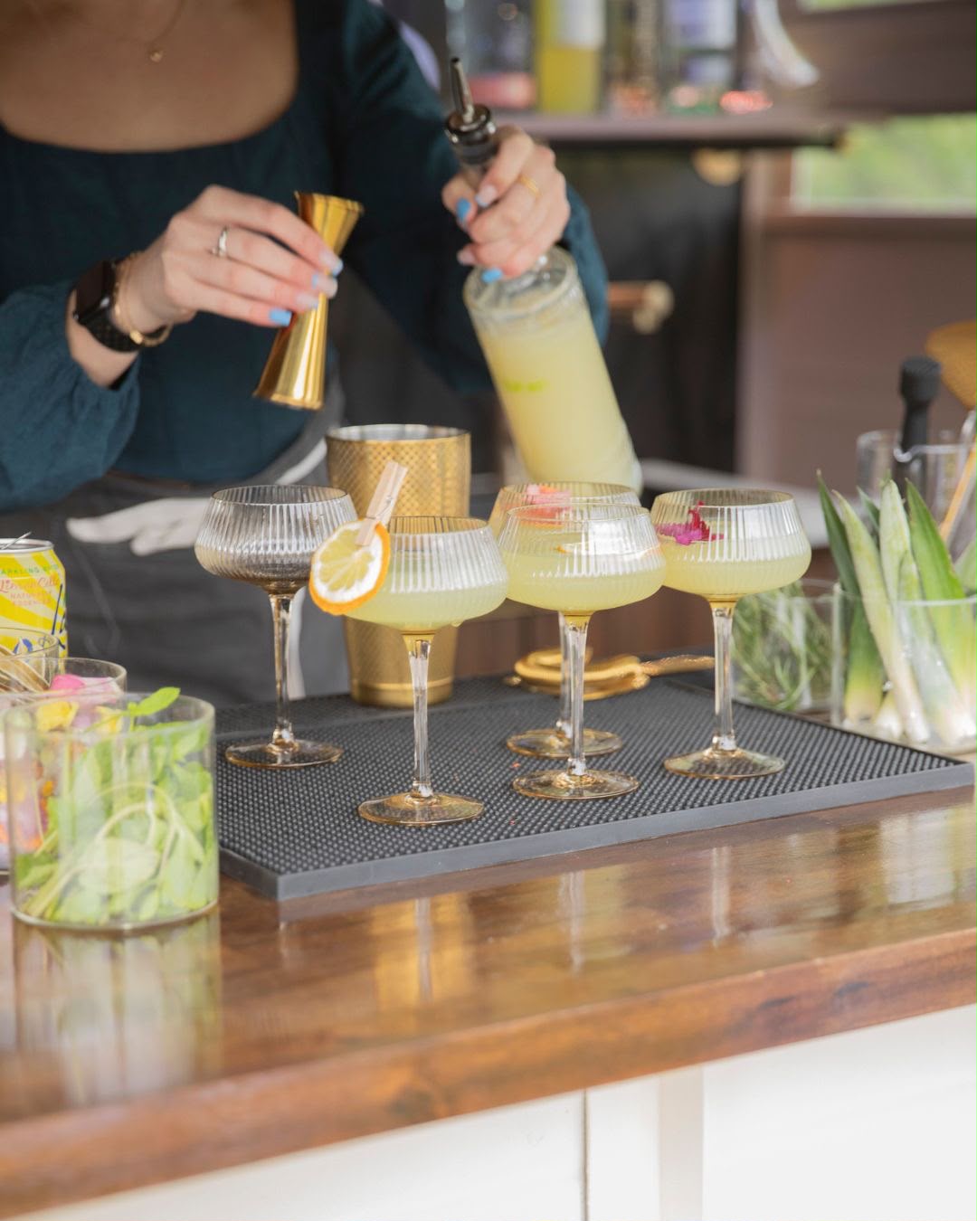 Tasteful Trends bartender pouring cocktails at the mobile bar