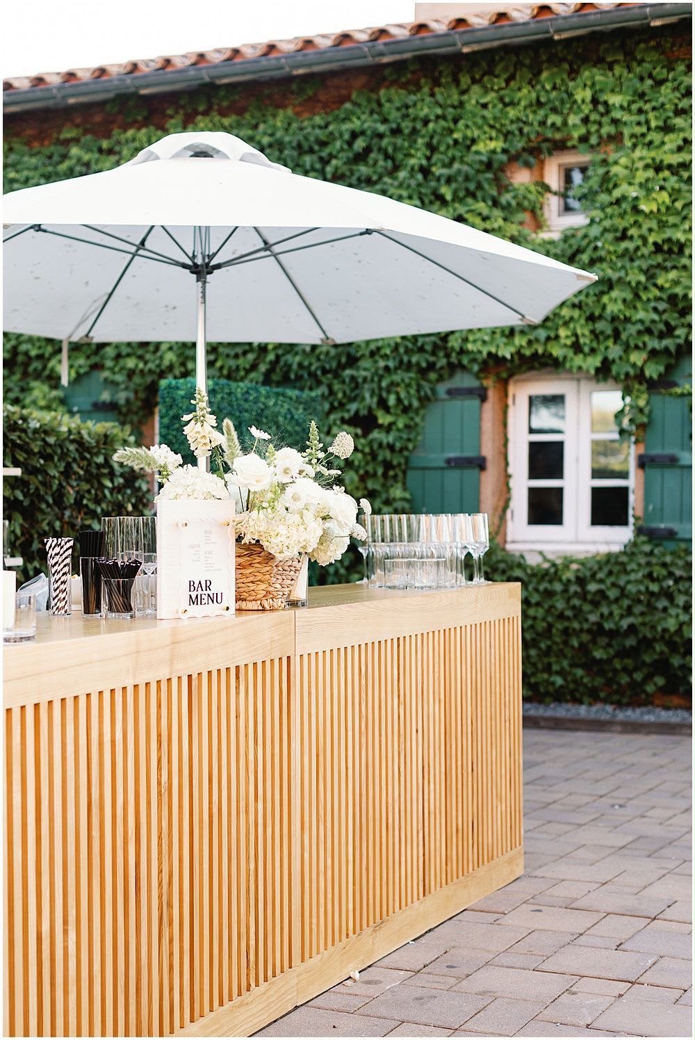 Tasteful Trends wooden mobile bar styled with flowers at a venue
